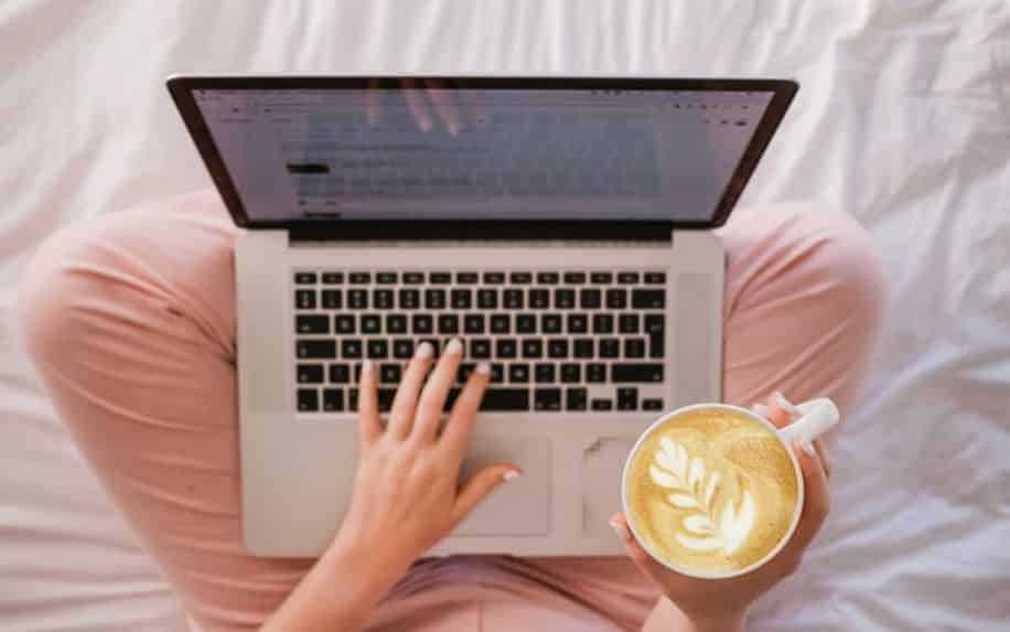 woman on laptop with a coffee  - Content Marketing 
