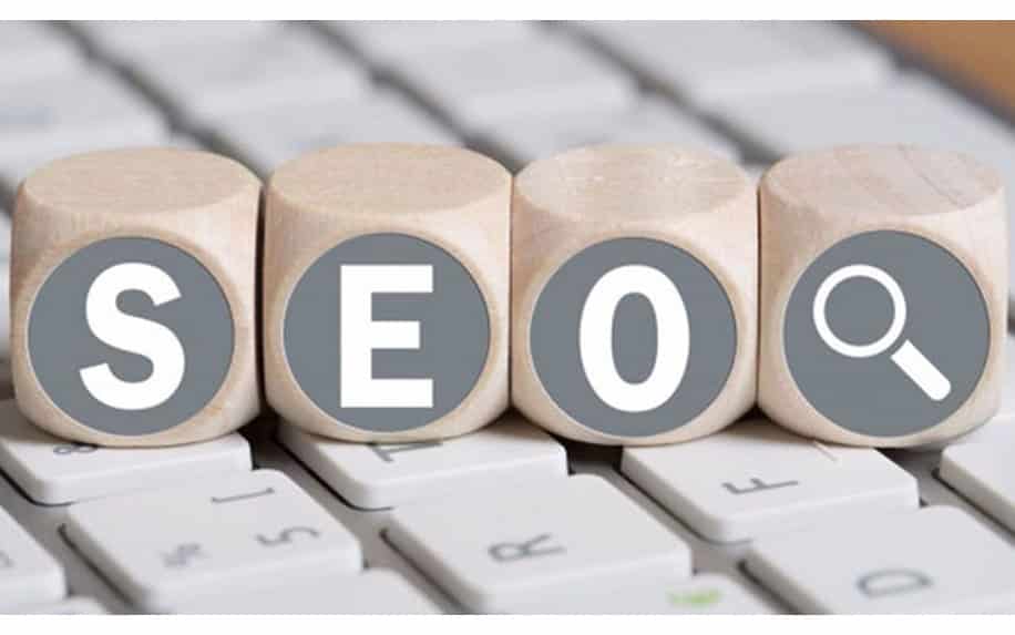 What Is SEO - SEO imagery applied to wooden blocks on a keyboard.