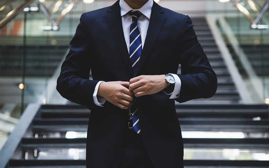 Photo of man in suit and tie