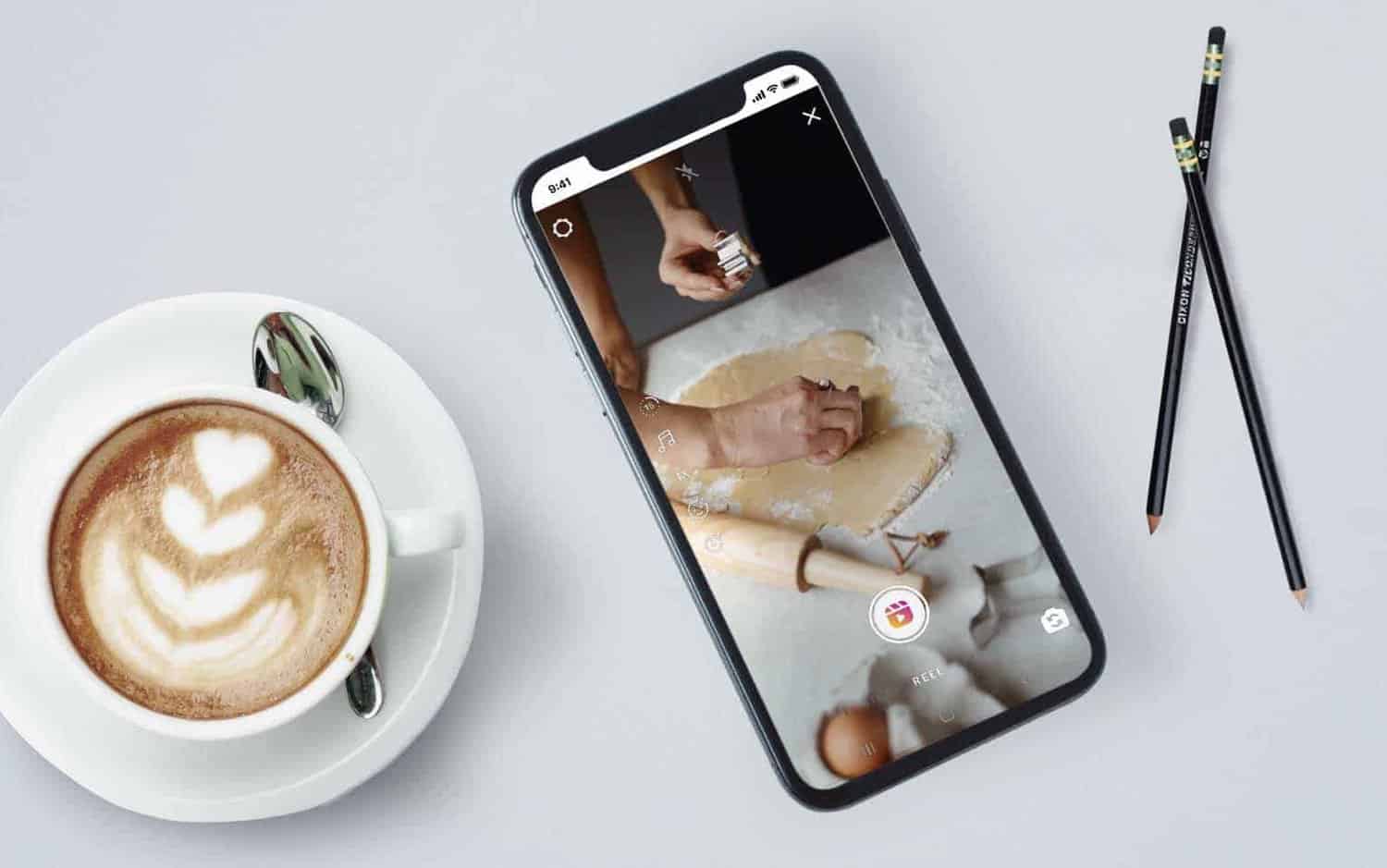 A smart phone on a white coffe table showing loading an Instagram reel