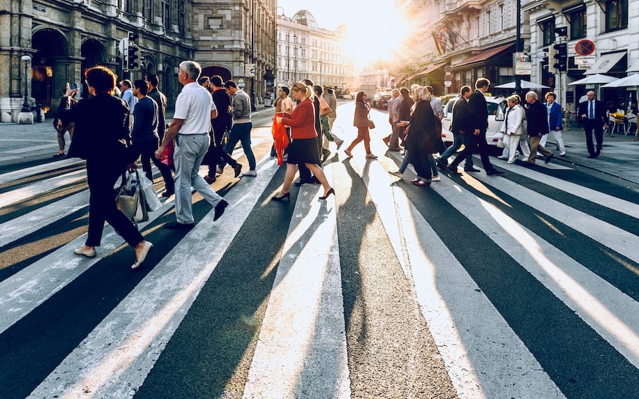 demographics Image showing a crowded street with a diverse range of people.