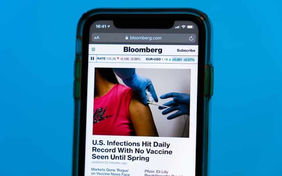 Bloomberg.com news article about “U.S. Infections Hit Daily Record With No Vaccine Seen Until Spring”. Image showing a news story relating to the covid-19 pandemic to portray the impact of events.