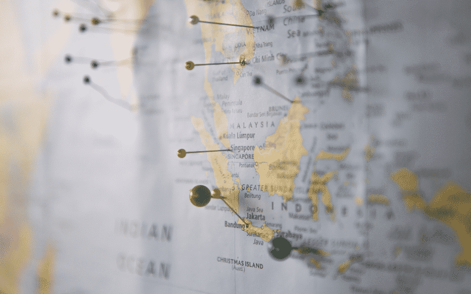 Map on wall with pins on locations