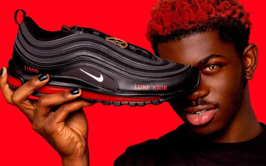 lil nas x holding the satan shoes
