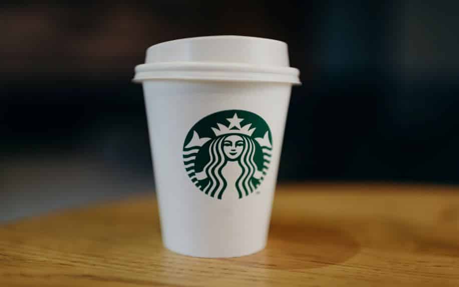 A Starbucks cup with their iconic green logo.