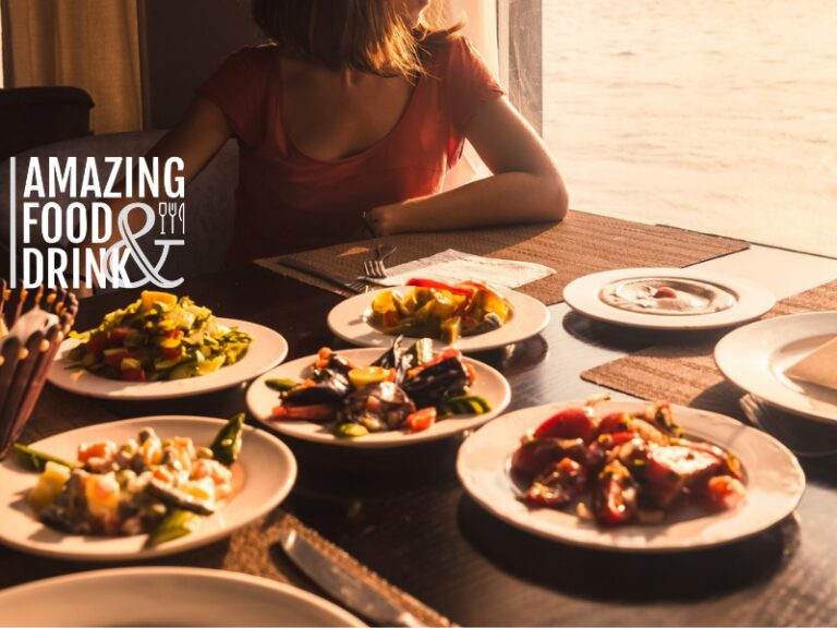 Food on table with Amazing Food and Drink logo in foreground