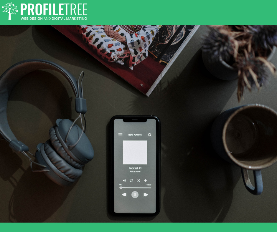 Podcast apps - a bird view of headphones, a cup of tea, and a phone playing a podcast