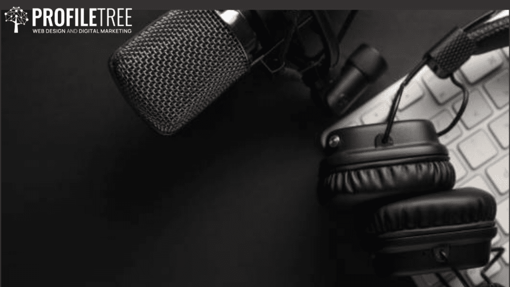 Podcast Software - A microphone and headphones laid on a black background