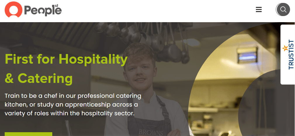 A young chef stands in a professional kitchen beneath hanging utensils. The text promotes training website design for hospitality and catering, encouraging apprenticeships and roles within the hospitality sector.
