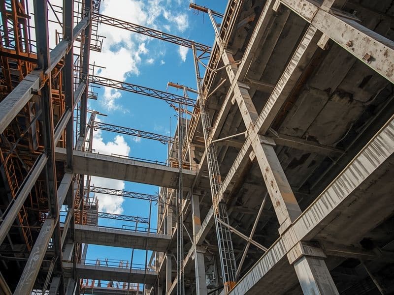 Steel structural framework on a construction site, highlighting how the advantages of CAD reduce costly clashes before building begins