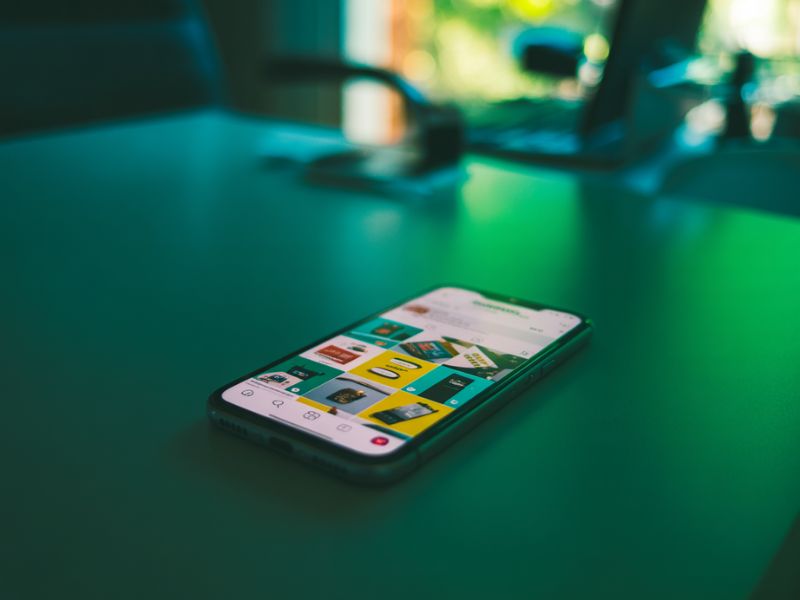 A smartphone displaying an Instagram feed, representing how Instagram ads appear to UK users on mobile devices.