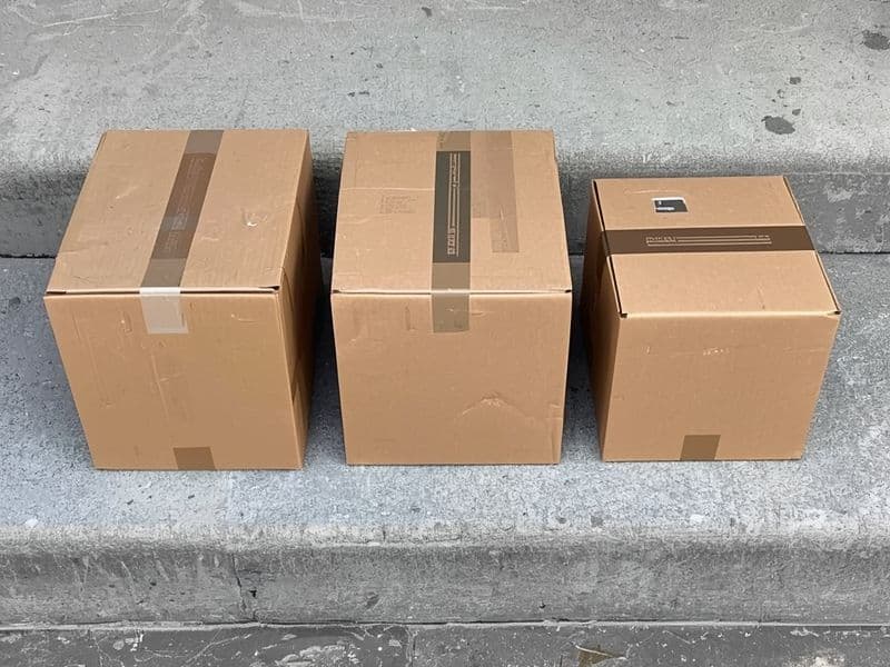 Three meal kit market delivery boxes of different sizes placed side by side representing the competitive provider landscape