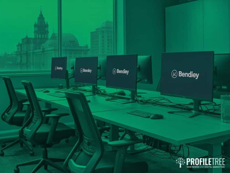 A Belfast digital agency office with branded monitors, representing how ProfileTree uses keyword research tools across client SEO campaigns