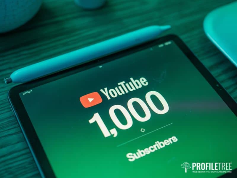 Tablet screen showing a YouTube subscriber milestone, representing the threshold required for YouTube Monetisation eligibility