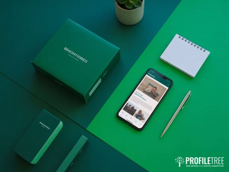 Branded product and smartphone on a desk surface, representing affiliate and brand partnership opportunities in YouTube Monetisation