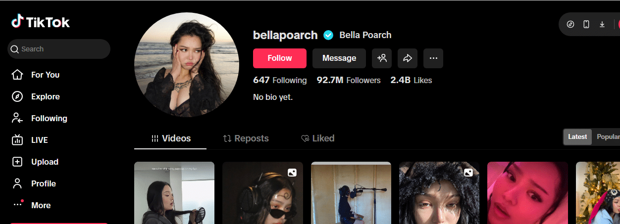 A screenshot of Bella Poarch's TikTok profile, showcasing her status as one of TikTok's most followed creators with 92.7M followers, 2.4B likes, her profile photo, verified tick, and a grid of video thumbnails on a dark-themed page.