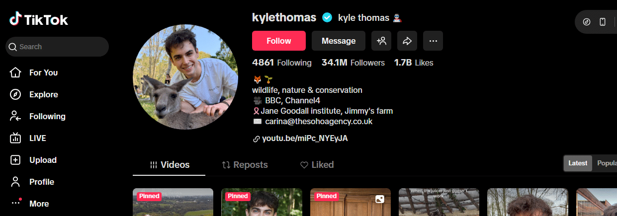 Screenshot of TikTok profile for kyletthomas, showing a smiling young man with a kangaroo. With 34.1M followers and 1.7B likes, he’s among TikTok’s most followed accounts. Bio highlights wildlife and conservation.