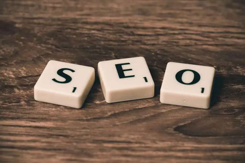 Three White and Black Scrabble Tiles Spelling Out SEO